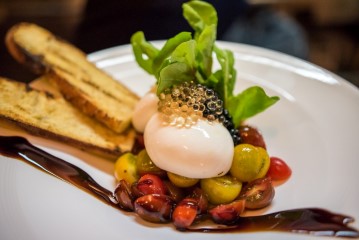 Burrata with spheres of black and white balsamic vinegar